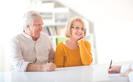 An older couple consulting a physician